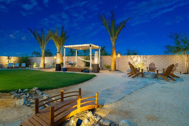 exterior space featuring a patio, a fire pit, and a lawn