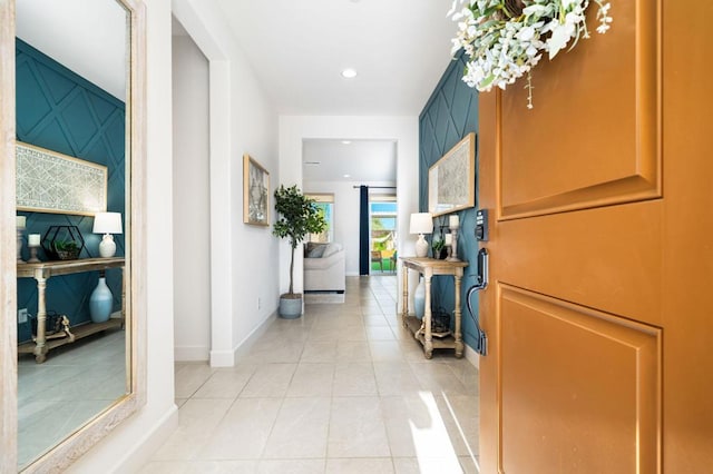 corridor featuring light tile patterned floors