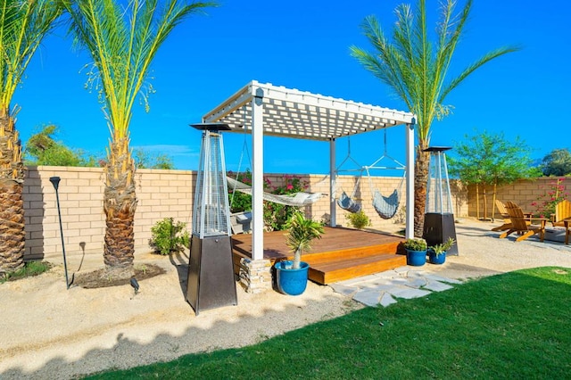 view of patio / terrace with a wooden deck and a pergola