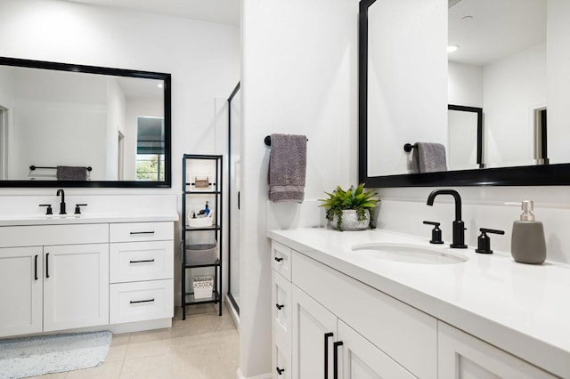 bathroom featuring tile patterned flooring and vanity