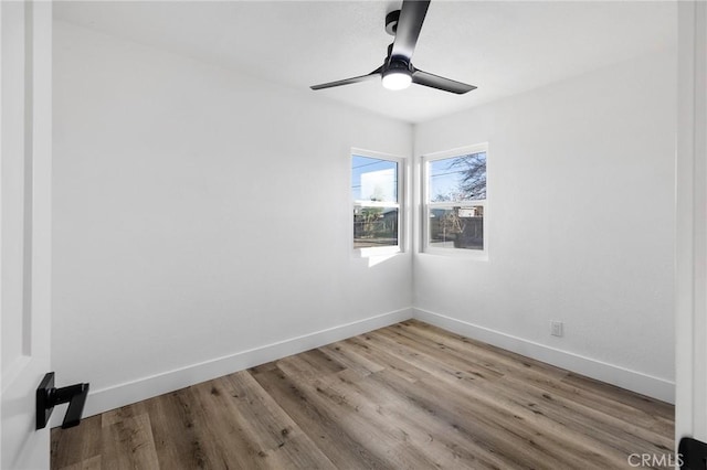 empty room featuring ceiling fan and light hardwood / wood-style floors