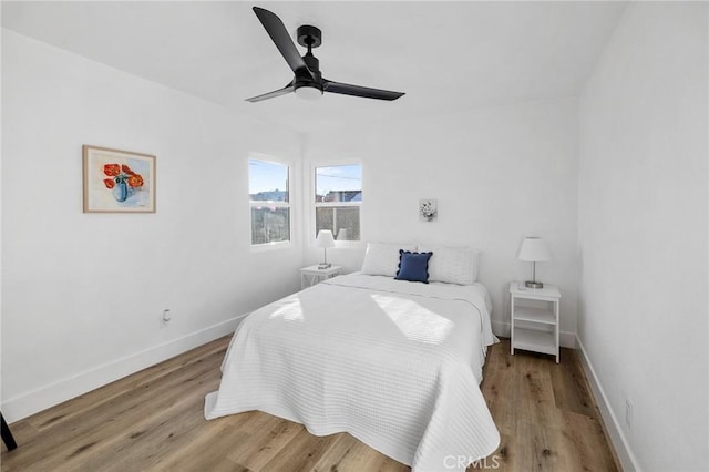 bedroom featuring ceiling fan and hardwood / wood-style floors