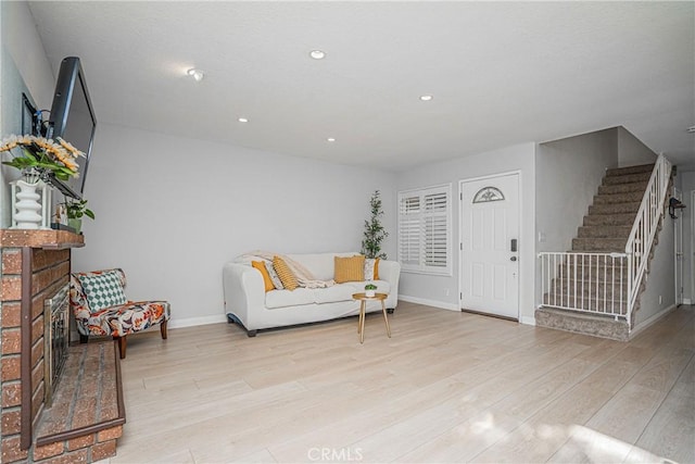 interior space featuring a fireplace and light wood-type flooring