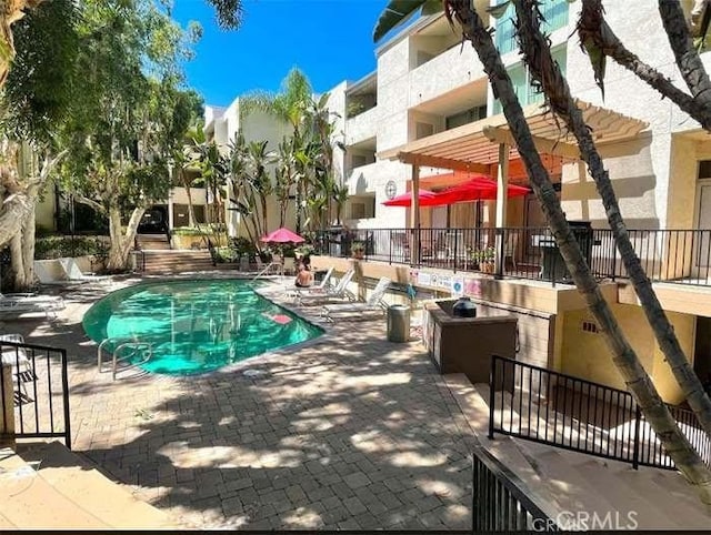 view of pool featuring a patio