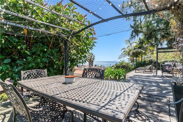 view of patio featuring a water view and a pergola