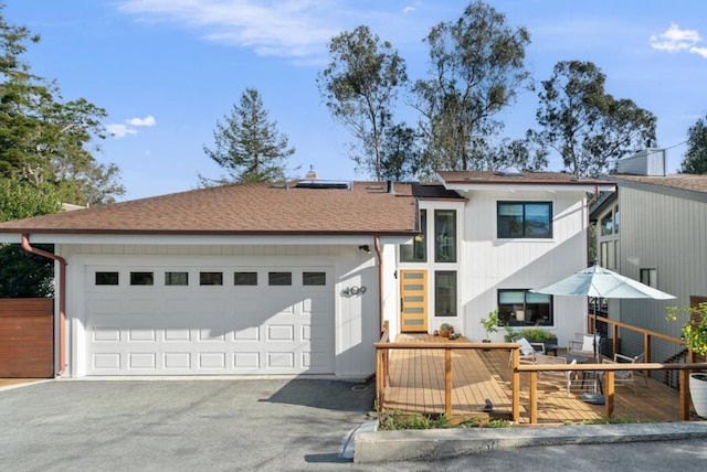 view of front facade featuring a garage and a deck