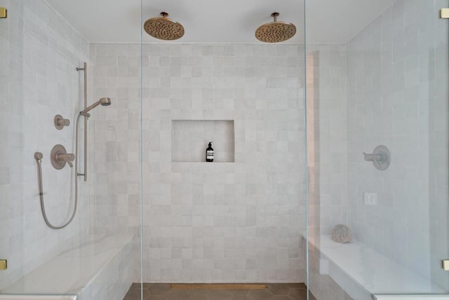 bathroom with a shower with shower door