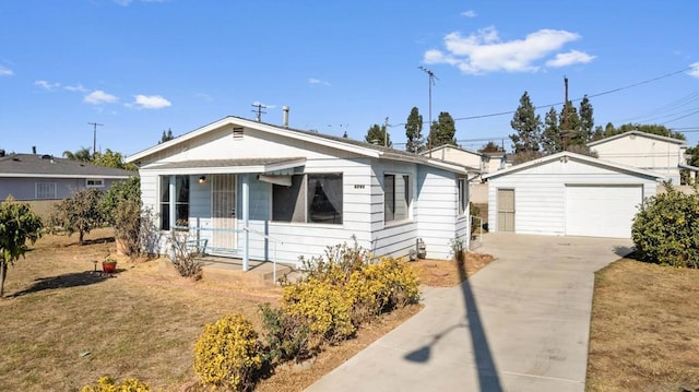 view of front of house featuring a garage and an outdoor structure