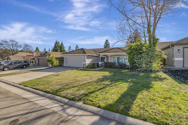 ranch-style home with a garage and a front lawn