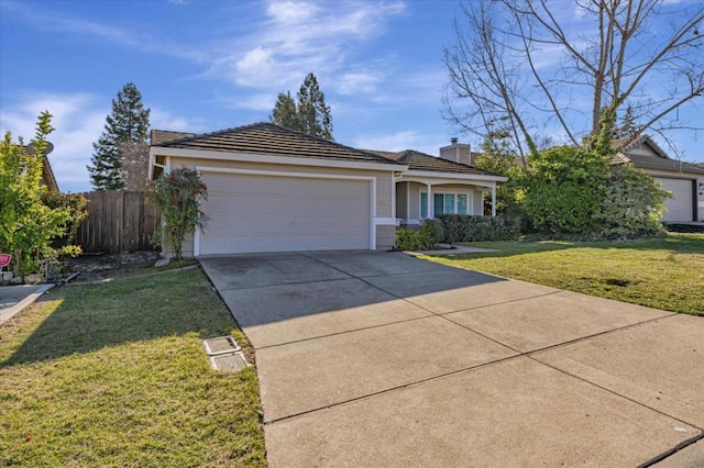 ranch-style house featuring a garage and a front yard