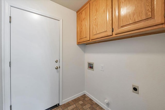 laundry room with cabinets, hookup for an electric dryer, and hookup for a washing machine