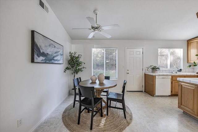 dining space featuring ceiling fan