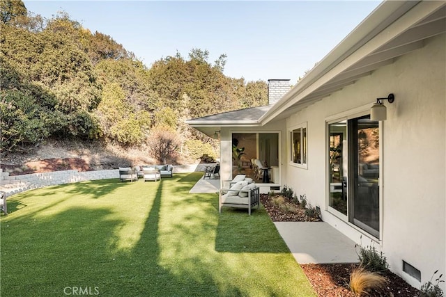 view of yard with a patio area and outdoor lounge area