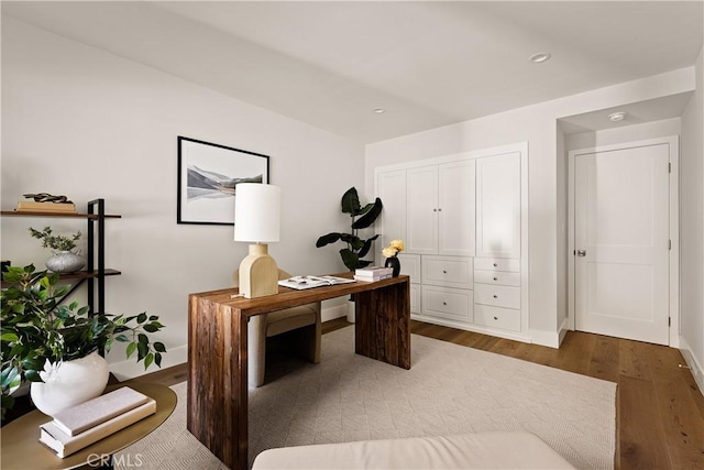 office area with recessed lighting, wood finished floors, and baseboards