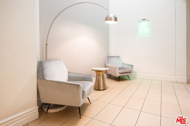 living area featuring light tile patterned floors