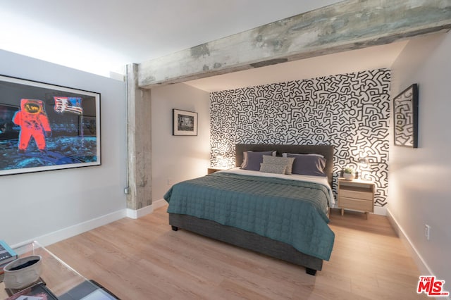 bedroom with light wood-type flooring