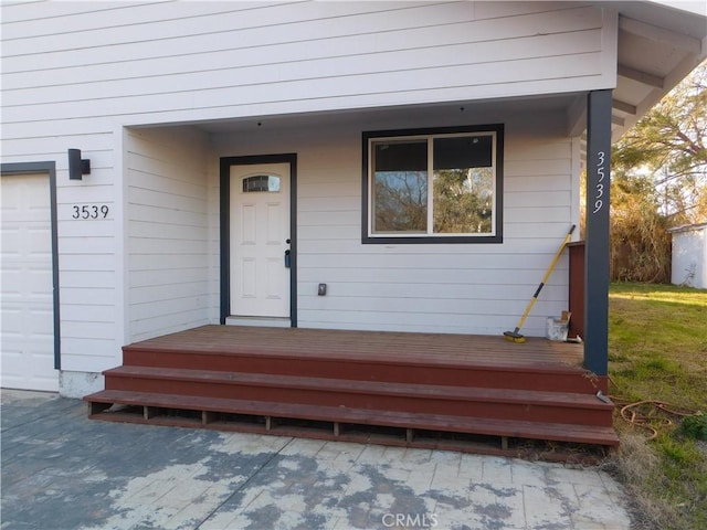 view of exterior entry with a garage