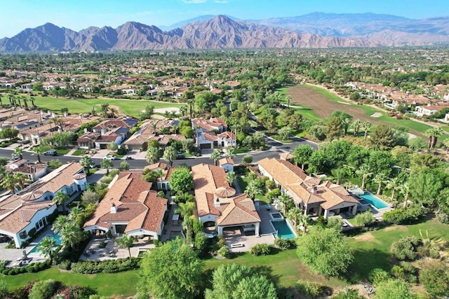 birds eye view of property featuring a mountain view