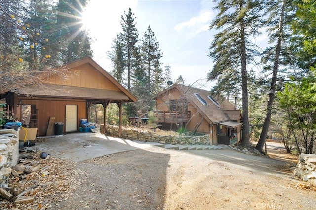 view of side of home featuring a carport