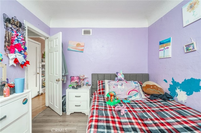 bedroom featuring light hardwood / wood-style flooring