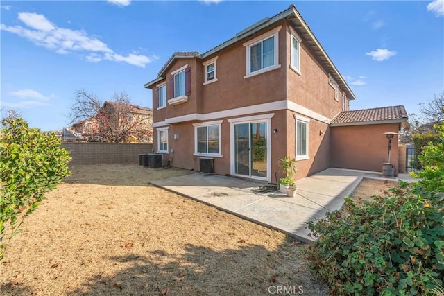 back of house featuring a patio area and central AC