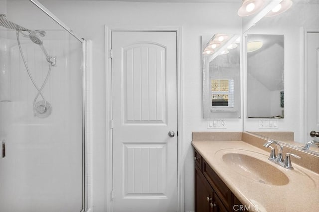 bathroom with an enclosed shower and vanity