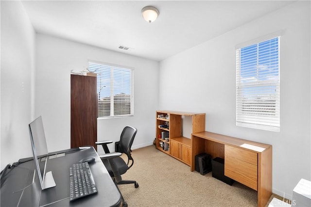 office area featuring light colored carpet