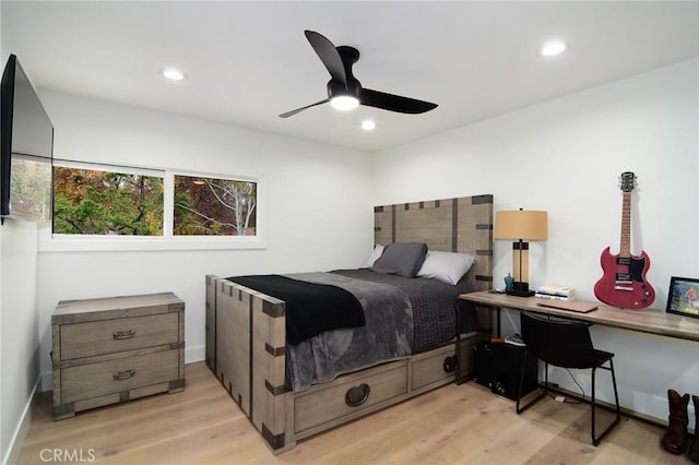 bedroom with light wood-type flooring and ceiling fan