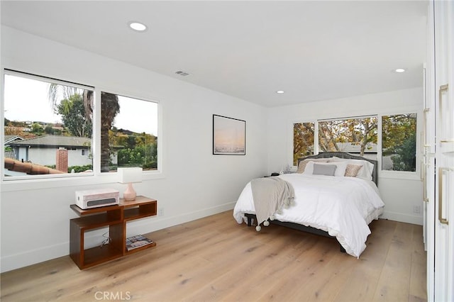 bedroom with light wood-type flooring