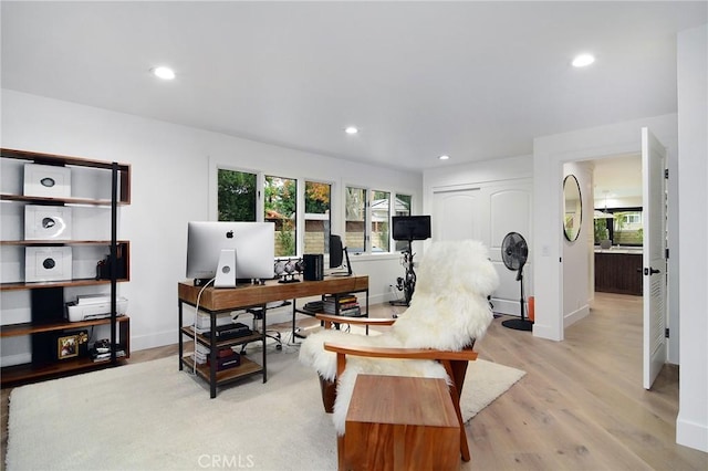 office area with light hardwood / wood-style flooring