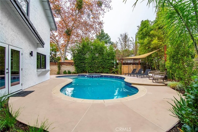 view of swimming pool with a patio area