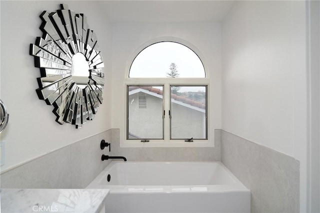 bathroom featuring a tub