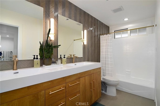 full bathroom featuring toilet, tile patterned flooring, shower / bath combination with curtain, and vanity