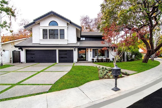 view of front facade with a front lawn and a garage