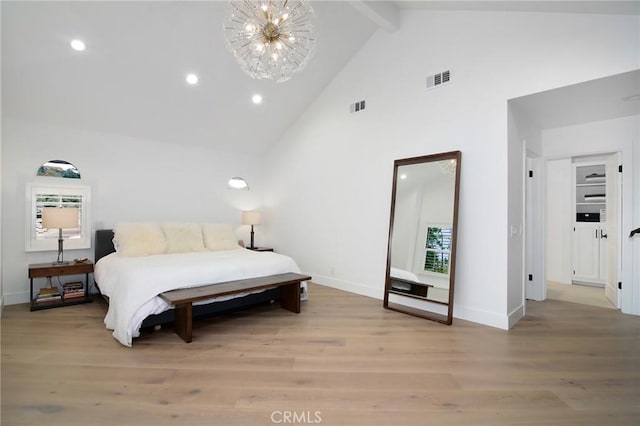 bedroom with high vaulted ceiling, light wood-type flooring, a notable chandelier, and beamed ceiling