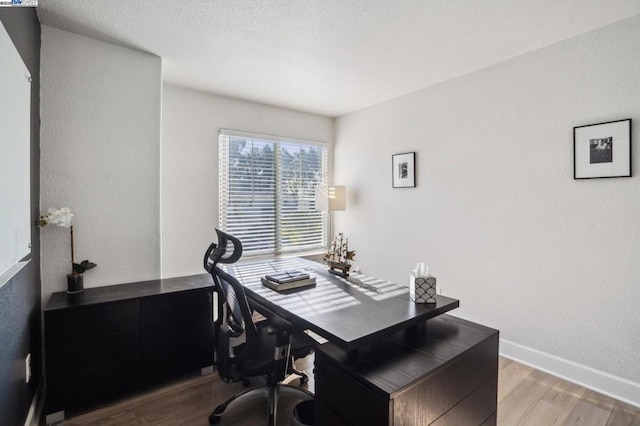 office with light hardwood / wood-style flooring