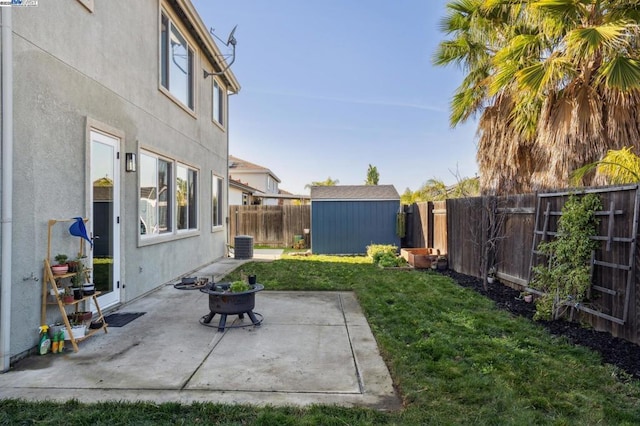 view of yard featuring a patio and a shed