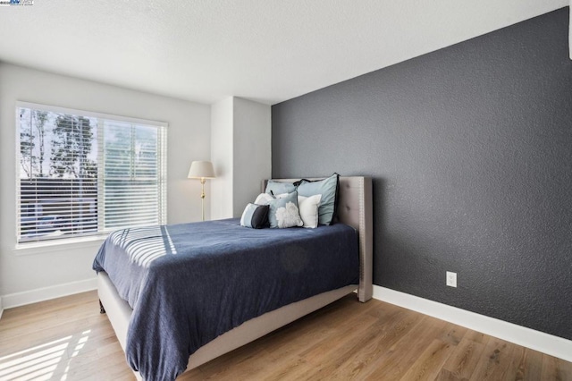 bedroom featuring hardwood / wood-style floors