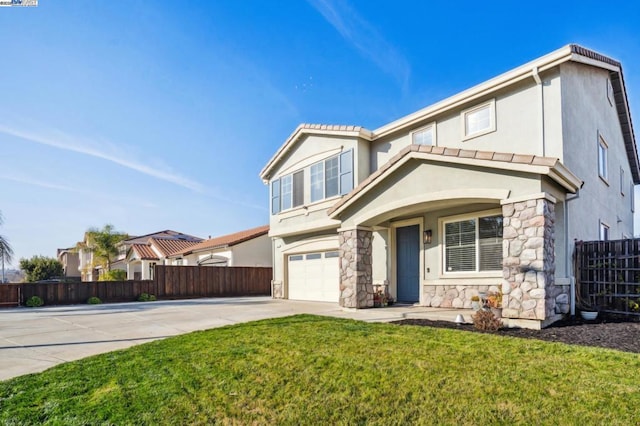 view of front of property with a garage and a front yard