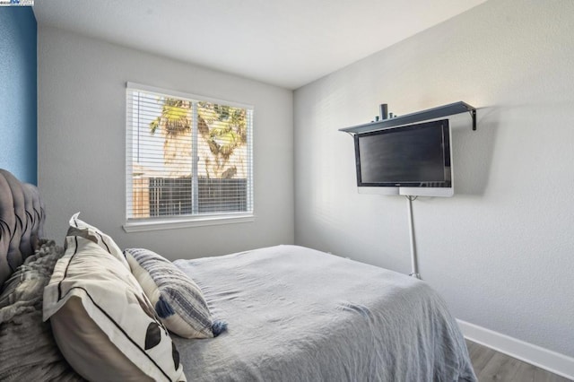 bedroom featuring hardwood / wood-style floors