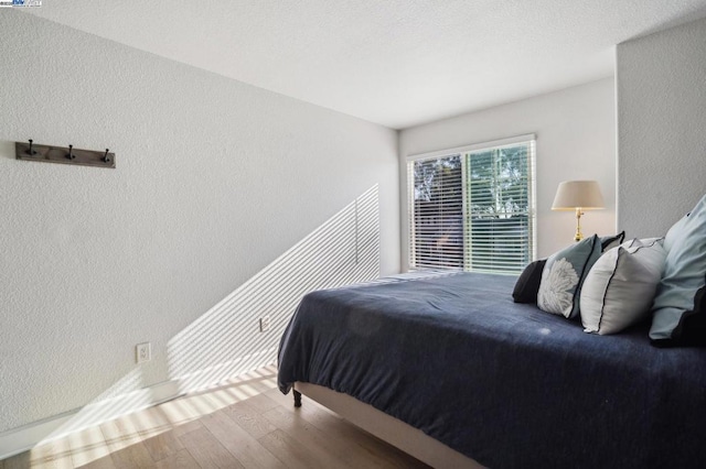 bedroom featuring hardwood / wood-style floors