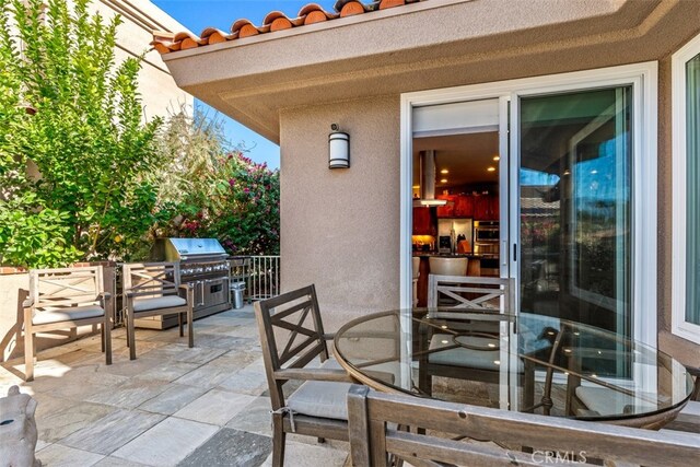 view of patio with a grill