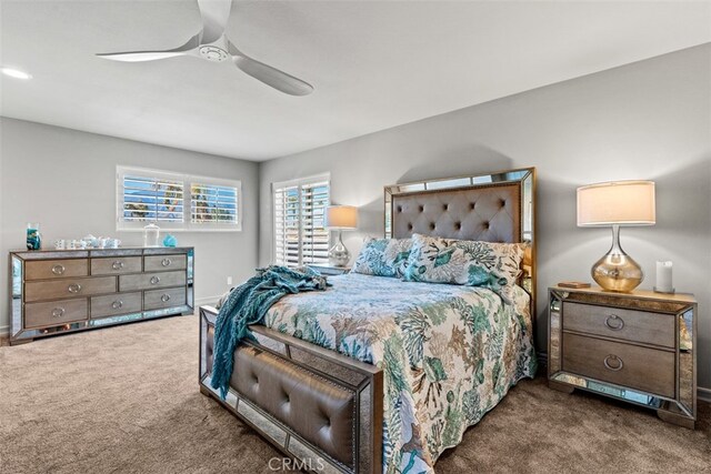 bedroom with ceiling fan and carpet