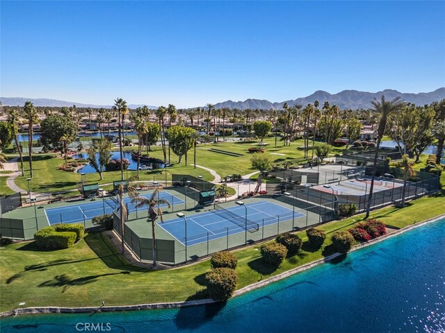 drone / aerial view featuring a water and mountain view