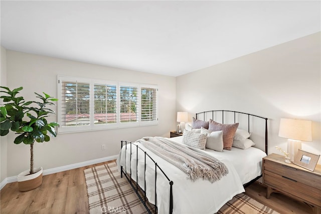 bedroom featuring hardwood / wood-style floors