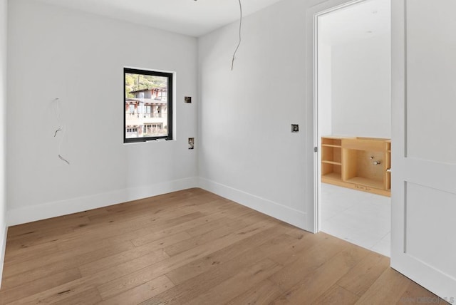 empty room with light hardwood / wood-style floors