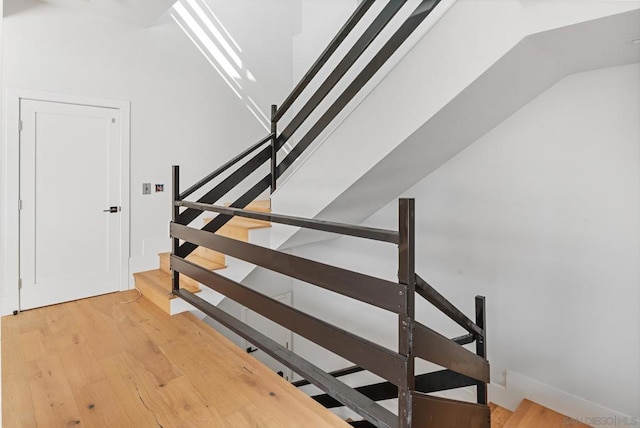 stairway featuring wood-type flooring