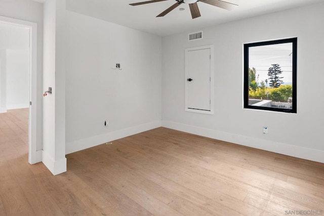 empty room with ceiling fan and light wood-type flooring