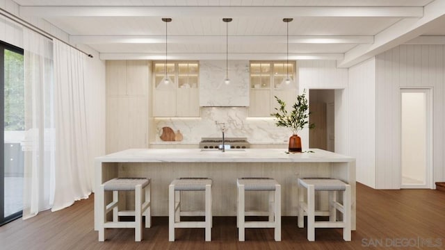 kitchen with a kitchen breakfast bar, dark wood-type flooring, beam ceiling, and decorative light fixtures