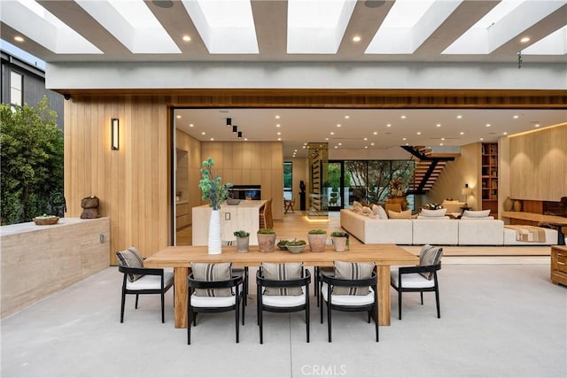 dining space with wooden walls